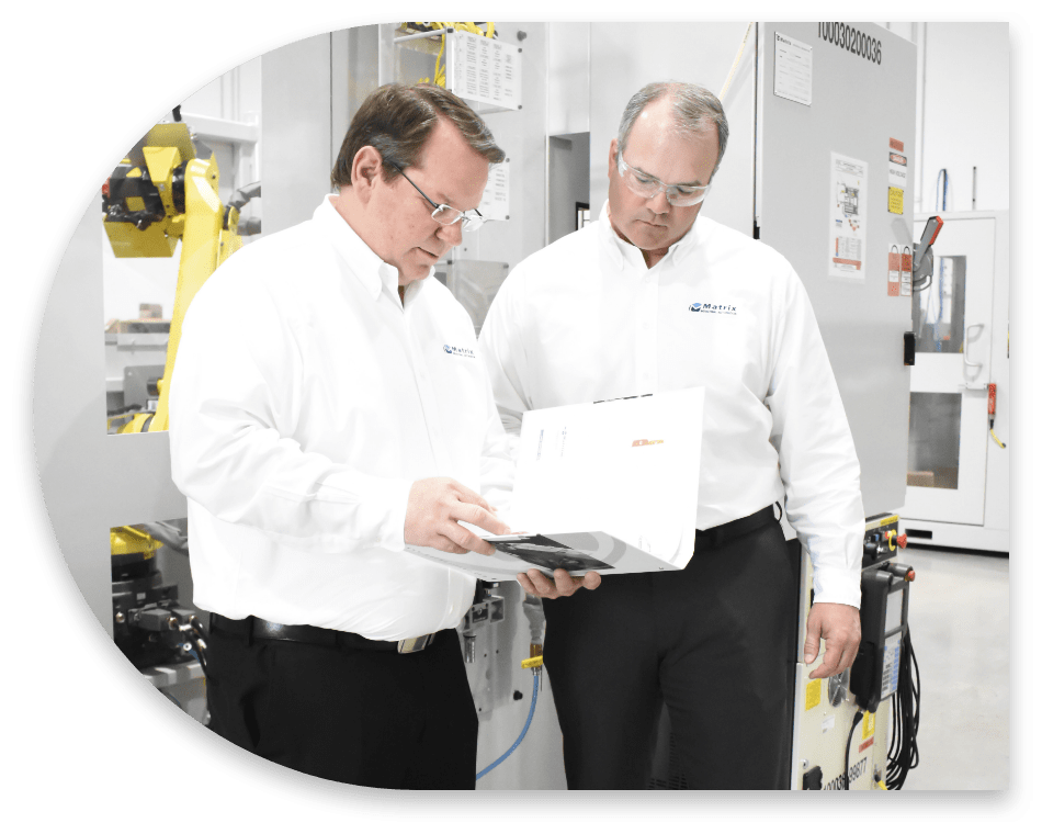 Two engineers discussing industrial automation